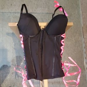 Black corset with pink ribbon accents
